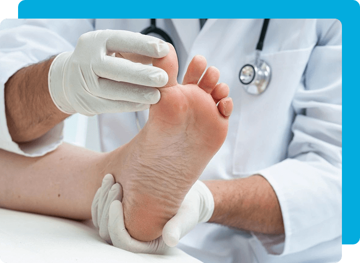 A doctor is examining the foot of someone.